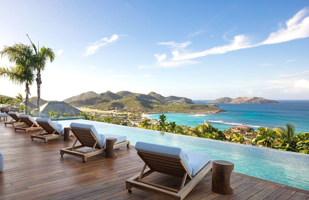 Pool deck with views over Saint Jean Bay at Villa Unique, a luxury villa in St Barts offered by St Barts Blue