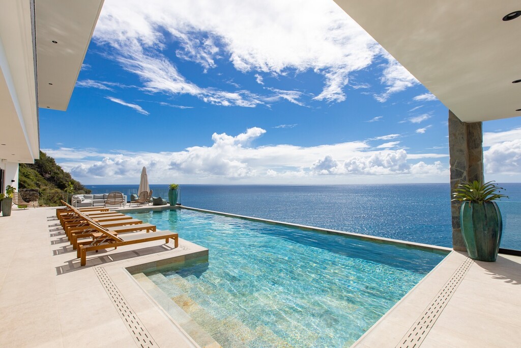 Infinity pool overlooking the Caribbean Sea at Aqua Dream, a luxury villa in Indigo Bay, St Martin, offered by St Martin Blue